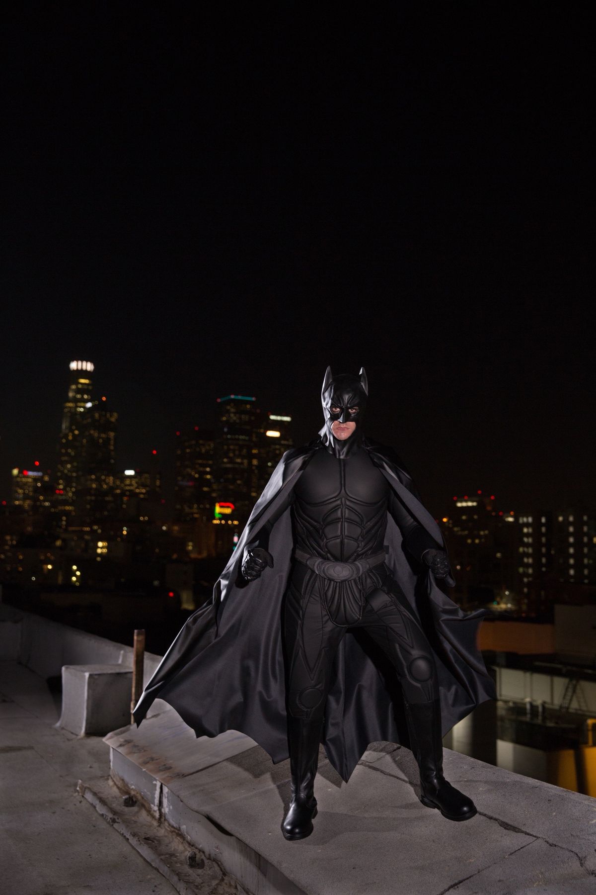 Batman superhero character at a children's birthday party with kids