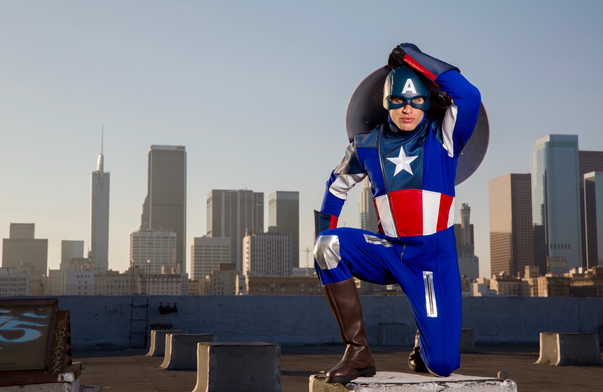 Captain America superhero character at a children's birthday party with kids
