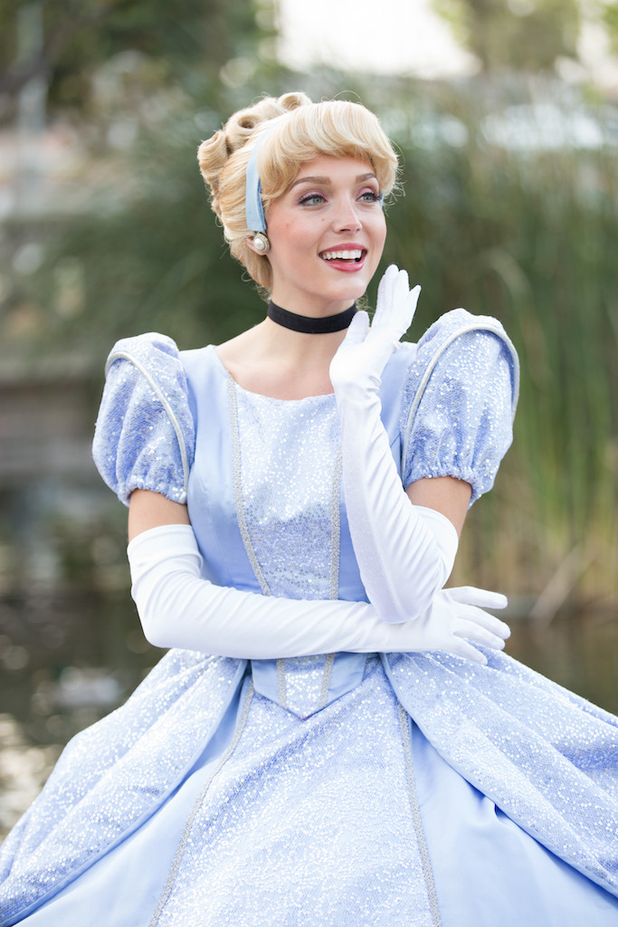 Cinderella princess character at a children's birthday party dancing with kids