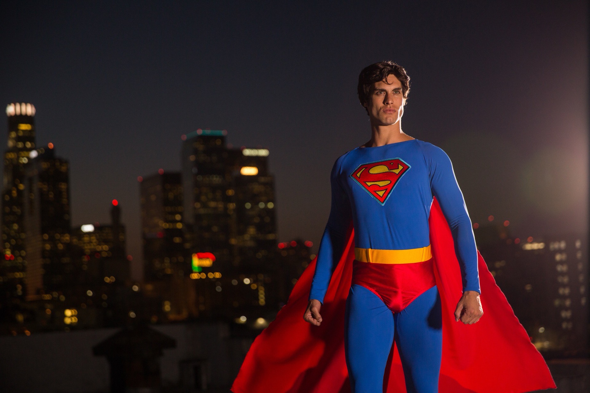 Superman superhero character at a children's birthday party with kids